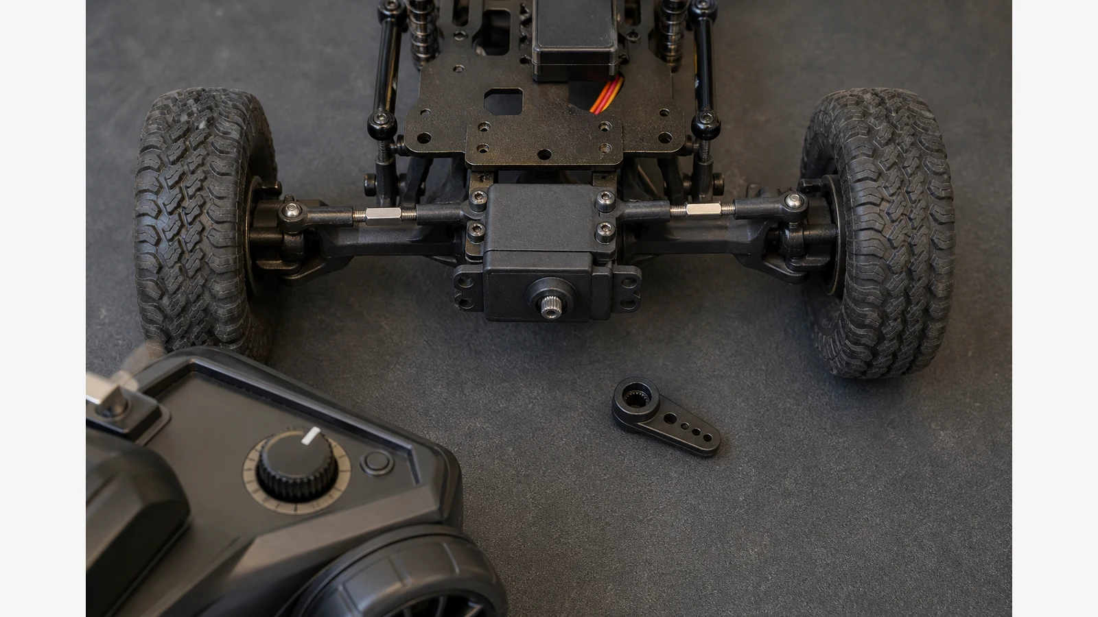 RC steering servo centred before its horn is fitted to straight front wheels